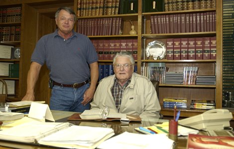 Charlie Nuckols Jr., breeder of War Emblem, at his desk with son Nucks (standing)  on May 6, 2002. NuckolsBreedersOrigs 1 image 10 Photo by Anne M. Eberhardt