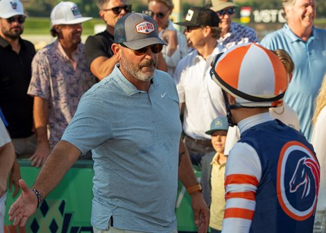 Billy Koch of Little Red Fether Racing, left, celebrates with jockey Antonio Fresu, right, after Iron Man Cal&#39;s victory in the Grade III, $100,000 Zuma Beach Stakes, Sunday, October 6, 2024 at Santa Anita Park, Arcadia CA.<br><br />
&#169; BENOIT PHOTO