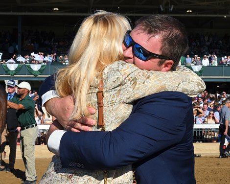 Owner Emilie Fojan hugging trainer Matt Sims. Brunacini with Luan Machado wins the Perryville (G3)  at Keeneland on Oct. 19, 2024.