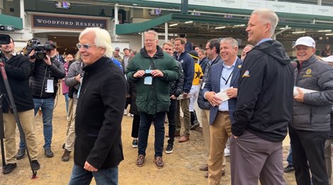 (L-R): Hall of Fame trainer Bob Baffert, Churchill Downs Inc. CEO Bill Carstanjen, and other onlookers smile after the trainer's victory with Barnes Nov. 27 at Churchill Downs