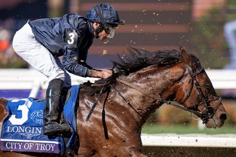 City of Troy (Ryan Moore) is covered in dirt as they pass the stands with a circuit to race in The Classic<br>
Del Mar 2.11.24 Pic: Edward Whitaker