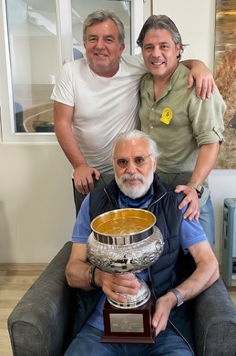 Turkish owner/breeder and American businessman Cem Sevim with his uncle Yaman Zingal and Hakan Sak, director with the Jockey Club of Turkey. Holding 2021 Turkish One Thousand Guineas trophy won by Light of Darkness.