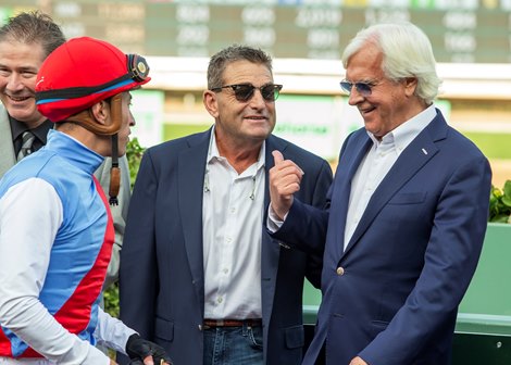 Trainer Bob Baffert, right, and assistant trainer Jimmy Barnes, center, celebrate with jockey Juan Hernandez, left, in the winner's circle after Barnes' victory in the G2 $200,000 San Vicente Stakes Saturday January 4, 2025 at Santa Anita Park, Arcadia, CA.  The 3-year-old son of Into Mischief is named after trainer Bob Baffert’s assistant trainer Jimmy Barnes.<br>
Benoit Photo