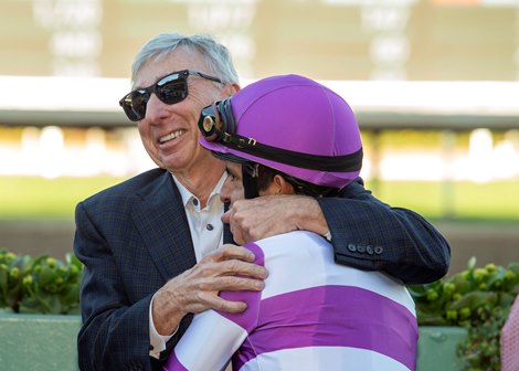 Owner J. Paul Reddam, left, has a hug for jockey Mario Gutierrez, right, in the winner's circle after Look Forward's victory in the $100,000 Fasig-Tipton Santa Ynez Stakes Sunday January 5, 2025 at Santa Anita Park, Arcadia, CA. Benoit Photo