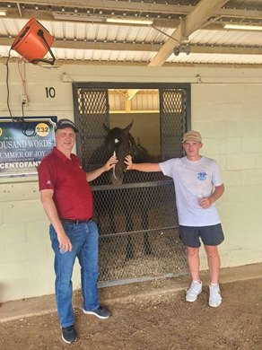 Owner Robbie Norman with stepson Logan and Cool Cowboy