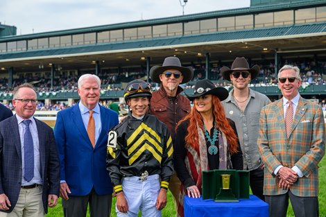 Presentation with trainer Brendan Walsh, left, jockey Jose Ortiz and presenter Wynonna. Gin Gin with Jose Ortiz won the Baird Doubledogdare (G3), at Keeneland on April 18, 2025, in Lexington, Ky. Presentation with trainer Brendan Walsh, left, jockey Jose Ortiz and presenter Wynonna. Gin Gin with Jose Ortiz won the Baird Doubledogdare (G3), at Keeneland on April 18, 2025, in Lexington, Ky.