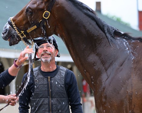 exercise rider Mark Cutler watching Burnham Square during his bath Training and feature shoots at Churchill Downs on April 26, 2025. exercise rider Mark Cutler watching Burnham Square during his bath Training and feature shoots at Churchill Downs on April 26, 2025.