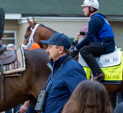 Trainer Mike McCarthy walks to the track with Derby morning line favorite Journalism for morning exercise before Saturday’s 151st running of the Kentucky Derby at Churchill Downs Wednesday April. 30, 2025 in Louisville, Kentucky   Photo by Skip Dickstein