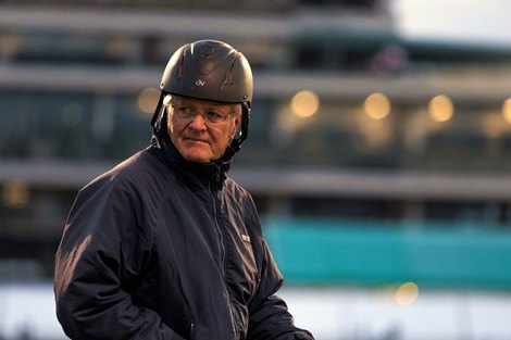 Trainer Bill Mott is out on horseback to watch his Derby entrant, Sovereignty, gallop.