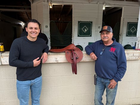 Mark Weber (right) and his son Dustin of Weber Tack with the saddle they custom-made for Sovereignty after his victory in the 2025 Kentucky Derby