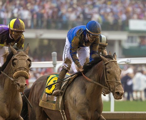 Sovereignty (blue cap) gallops out after winning the 151st Kentucky Derby. Journalism (dark and light blue cap) was 2nd and Baeza (purple and yellow cap) was 3rd.