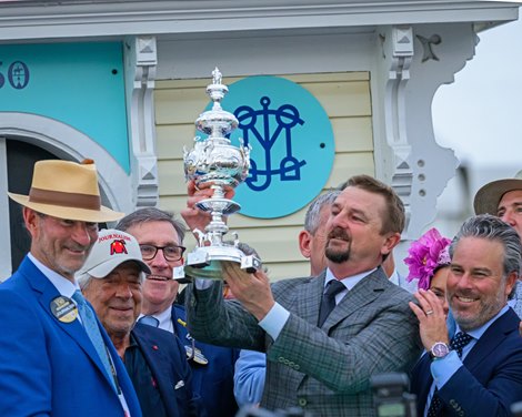 (L-r): George Isaacs, Robert LaPenta, McCarthy holding trophy and Aron Wellman on right. Journalism with Umberto Rispoli wins the Preakness Stakes (G1) at Pimlico Race Course in Baltimore, Md., on May 17, 2025. Trained by Michael McCarthy and owned by Eclipse Thoroughbred Partners, Bridlewood Farm, Don Alberto Stable, LaPenta, Robert V., Elayne Stables 5, Magnier, Mrs. John, Tabor, Michael B. and Smith, Derrick (L-r): George Isaacs, Robert LaPenta, McCarthy holding trophy and Aron Wellman on right. Journalism with Umberto Rispoli wins the Preakness Stakes (G1) at Pimlico Race Course in Baltimore, Md., on May 17, 2025. Trained by Michael McCarthy and owned by Eclipse Thoroughbred Partners, Bridlewood Farm, Don Alberto Stable, LaPenta, Robert V., Elayne Stables 5, Magnier, Mrs. John, Tabor, Michael B. and Smith, Derrick