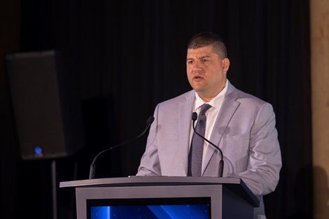 John Stewart, CEO/Cofounder of Fastbreak AI speaks at the Seventy-Third Annual Round Table Conference on Matters Pertaining to Racing held at the Hall of Springs Thursday July 31, 2025 in Saratoga Springs, N.Y.  Photo Courtesy of The Jockey Club.