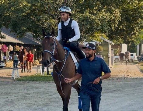 Assistant trainer Francisco Serrano leads Thorpedo Anna and jockey Luis Rivera Jr. to the Oklahoma Training Track