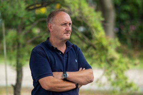 Neils Petersen, trainer of Queen Azteca watches as his charge goes out for a gallop on the Oklahoma Training CenterTrack Thursday August 14, 2025 in Saratoga Springs, N.Y.  Skip Dickstein Photo