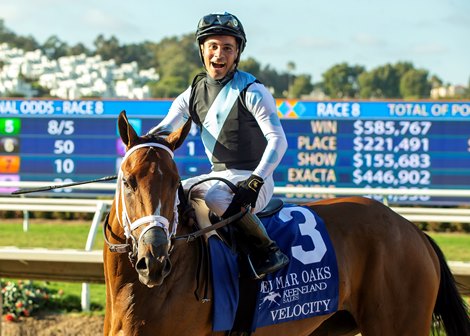Eclipse Thoroughbred Partners’ Velocity and jockey Ricardo Gonzalez, right, spring an upset win in the Grade I Del Mar Oaks Saturday, August 16, 2025 at Del Mar Thoroughbred Club, Del Mar, CA.  The three-year-old filly, trained by Michael McCarthy, overcame the favorites Lush Lips, second from right, and Thought Process, third from right for the win, and returned $72 for a $2 win bet.<br>
Benoit Photo