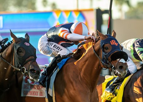 Gold Phoenix and jockey Flavien Prat, middle, overpower Stay Hot (Mike Smith), right, and Truly Quality (Umberto Rispoli), left, to win the Grade II, $300,000 Del Mar Handicap, Saturday, August 30, 2025 at Del Mar Thoroughbred Club, Del Mar CA.<br>
© BENOIT PHOTO,