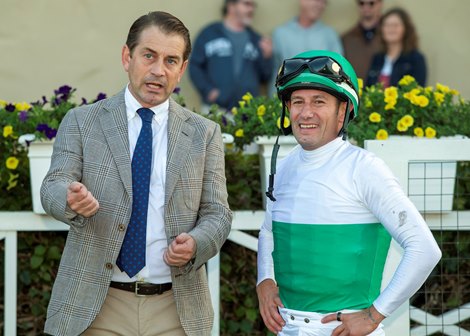Trainer Jonathan Thomas, left, celebrates with jockey Mirco Demuro, right, in the winner's circle after Truly Quality's victory in the Grade II, $200,000 Hollywood Turf Cup, Friday, November 28, 2025 at Del Mar Thoroughbred Club, Del Mar CA.<br>
© BENOIT PHOTO