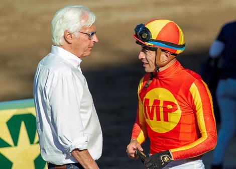 Trainer Bob Baffert, left, celebrates with jockey Juan Hernandez, right, in the winner's circle after Forced Entry's victory in the Grade III, $100,000 Santa Ysabel Stakes, Sunday, March 8, 2026 at Santa Anita Park, Arcadia CA><br>
g BENOIT PHOTO