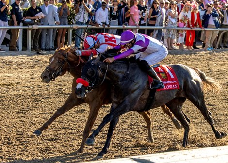 3-21-26 Emerging Market, with Flavien Prat aboard in red and white silks, wins the 113th running of the $1,000,000 Grade II Louisiana Derby at Fairgrounds Racecourse in New Orleans, LA. Hodges Photography/Amanda Hodges Weir