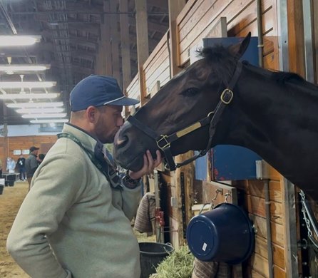 Trainer Whit Beckman gives Ocelli a kiss at Laurel Park two days before the 2026 Preakness Stakes.