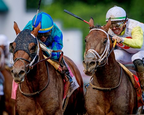 Corporate Power, left, with Jose L. Ortiz wins the Alysheba Stakes G2 Turf race” at Churchill Downs in Louisville, Ky., on May 1, 2026.  Corporate Power bumped Skippylongstocking, right, with jockey Tyler Gaffalione during the race.