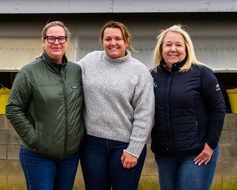 (L-r): Daisy Phipps Pulito, Cherie DeVaux, and Monique Delk  at the DeVaux barn  at Keeneland on April 22, 2026.