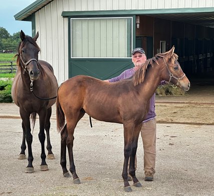 Keith Crupper with 5 1/2-month-old Crupper and Crupper's dam, the late She's All In, at Keith Crupper's farm in Paris, Ky. The colt was bred by Robert Zoellner.