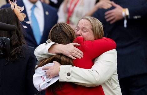 Trainer Cherie DeVaux, left, and co-owner Daisy Phipps Pulito, right, embrace in the winner’s circle after winning the Kentucky Derby, presented by Woodford Reserve, (G1) with Golden Tempo and Jose Ortizat Churchill Downs in Louisville, Ky., on May 2, 2026.