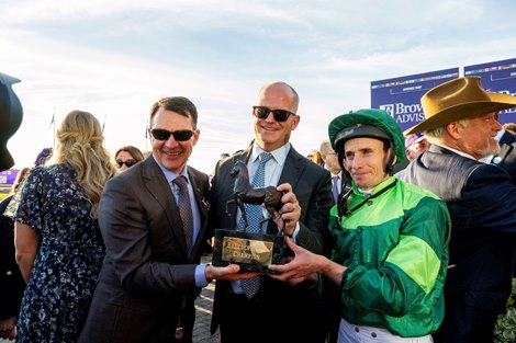 Haffner with Ryan Moore wins the Grade 1 Breeders’ Cup Juvenile Turf, at Keeneland Racecourse in Lexington, KY on October 30, 2026. Left to Right, Aidan O’Brien, M.V. Magnier and Ryan Moore hold the trophy.